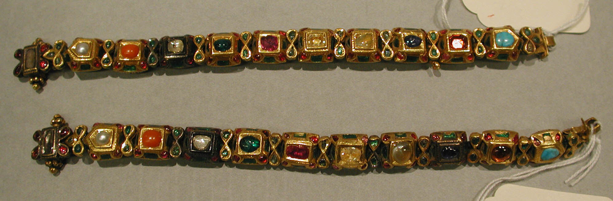 A pair of nineteenth-century Indian navaratna bracelets set with nine gems
